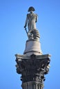 London, UK. 04.20.2016. Close-up view of Nelson column at Trafalgar Square in London on a very clear blue sky.