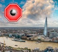 London, UK. Concept image with large red coronavirus warning sign in front of city skyline, travel restriction concept, covid-19