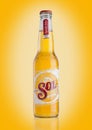 LONDON, UK - DECEMBER 15, 2016: Bottle of Sol Mexican Beer on yellow background. From the Cuauhtemoc Moctezuma Brewery, in