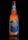 LONDON, UK, DECEMBER 15, 2016: Bottle of Tiger Beer on black background, First launched in 1932 is Singapore`s first brewed beer.