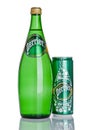 LONDON, UK - DECEMBER 06, 2016: Bottle and tin of Perrier sparkling water. Perrier is a French brand of natural bottled mineral wa Royalty Free Stock Photo