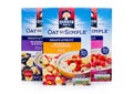LONDON, UK - DECEMBER 15, 2017: Boxes of Quaker Oats porridge with and fruits on white. It has been owned by PepsiCo since 2001.