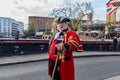 London, UK - 20, December 2018: Man in 18th century British army infantry redcoat uniform walking in Camden Town, UK