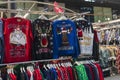 A temporary seasonal display of ugly Christmas sweaters at a retail store Royalty Free Stock Photo