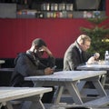 People eat in the street cafe