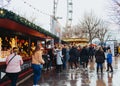 London, UK/Europe; 21/12/2019: Winter Christmas market in Southbank, London. People eating, drinking and having fun with friends Royalty Free Stock Photo