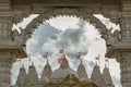 Entrance archway of the Neasden temple (BAPS Shri Swaminarayan Mandir) against a nice cloud sky background