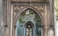 Perspective view of The stone arched entrance and Stone window frame inside of St Dunstan in the East Church Garden Royalty Free Stock Photo