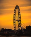 London UK February 2021 Amazing late sunset over London, silhouettes of the buildings and the London eye contrasting the dark Royalty Free Stock Photo