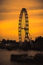 London UK February 2021 Amazing late sunset over London, silhouettes of the buildings and the London eye contrasting the dark Royalty Free Stock Photo