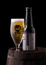 LONDON, UK - FEBRUARY 06, 2019: Bottle and glass of Mr.President IPA beer, from the Brewdog brewery on old wooden barrel Royalty Free Stock Photo