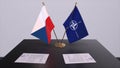 London, UK - 15 February 2023: Czech country national flag and NATO flag. Politics and diplomacy illustration