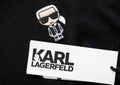 LONDON, UK - FEBRUARY 15, 2024: Karl Lagerfeld logo tag and emblem on black premium fabric.Macro