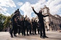 Group of Black Lives Matters protesters in front of Sir Winston Churchill Monument statue recording video clip holding their fists