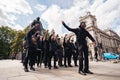 Group of Black Lives Matters protesters in front of Sir Winston Churchill Monument statue recording video clip holding their fists