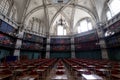 Interior of the Octagon Library at Queen Mary, University of London in Mile End, East London, with colourful leather bound books