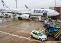 London UK IranAir passenger jet airplane being filled with supplies at Heathrow Airport on a rainy day