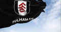 flag of Fulham Football Club waving in the wind on a clear day