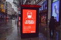 COVID-19 face mask sign on a bus stop in London, UK Royalty Free Stock Photo