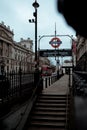 London UK January 2021 Entrance to the Westminster underground tube station. Cold winter day, union jack flag in the background.