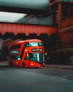 London UK January 2021 Panning shot of a popular red double decker London bus, background blurred in motion. Dark vertical moody Royalty Free Stock Photo