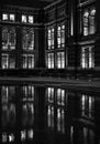 Monochrome photo of theJohn Madejski Garden at the Victoria and Albert Museum, photographed at night with reflection in the water.