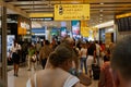 London, UK, 03 Jul. 2009: Many passengers walking toward A13-23 Gates in Heathrow Airport. Different direction and AD Royalty Free Stock Photo