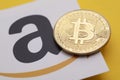 LONDON, UK - July 2021: Bitcoin cryptocurrency on an amazom e-commerce logo