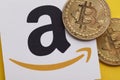 LONDON, UK - July 2021: Bitcoin cryptocurrency on an amazom e-commerce logo