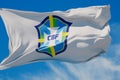 LONDON, UK - July 2023: Brazil national football team logo badge on a flying flag. 3D Rendering