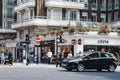 Car driving in front of Costa Coffee cafe in Marylebone, London, UK