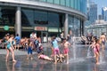 Children enjoying summer at a fountain in London