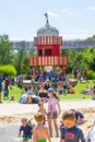 Children\'s play ground at hot summer day and kids playing with sand and water. Royalty Free Stock Photo