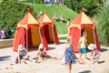 Children\'s play ground at hot summer day and kids playing with sand and water. Royalty Free Stock Photo