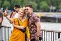 London, UK, July, 2019. Close up portrait of happy attractive couple taking selfie in London