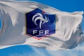 LONDON, UK - July 2023: France national football team logo badge on a flying flag. 3D Rendering