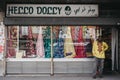 Man standing outside Hello Dolly fabric and haberdashery shop in