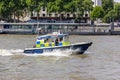 London, UK - 25 July, 2018: Metropolitan Police Boat sails London Thames at hight speed