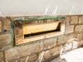 A brass fitted letter box flap. London, UK.