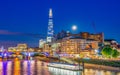 LONDON, UK - JULY 2ND, 2015: City modern skyline with Thames river reflections at night Royalty Free Stock Photo