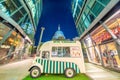 LONDON, UK - JULY 2ND, 2015: Ice Cream small bus among modern buildings and St Paul Cathedral on the background at night Royalty Free Stock Photo