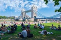 People enjoying summer near Tower Bridge in London