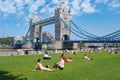 People enjoying summer near Tower Bridge in London