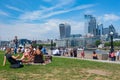 People enjoying summer near Tower Bridge in London