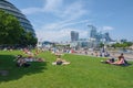 People enjoying summer near Tower Bridge in London