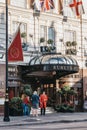 People talking to butler outside The Rubens at the Palace hotel located in London, UK Royalty Free Stock Photo