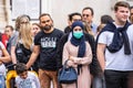 London, UK, July 28, 2019. People Watching Street Performance. Young Asian woman wearing pollution face mask