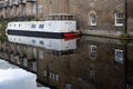 The Regent`s Canal runs through an area of ongoing regeneration with new apartment buildings Royalty Free Stock Photo