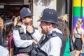 London, UK, July, 2019. Two British Police officers patrolling the streets of England wearing stab vests. Oxford Street. Selected Royalty Free Stock Photo