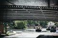 View from under the bridge of boats on a sunny day on Regents Canal in Little Venice, London, UK